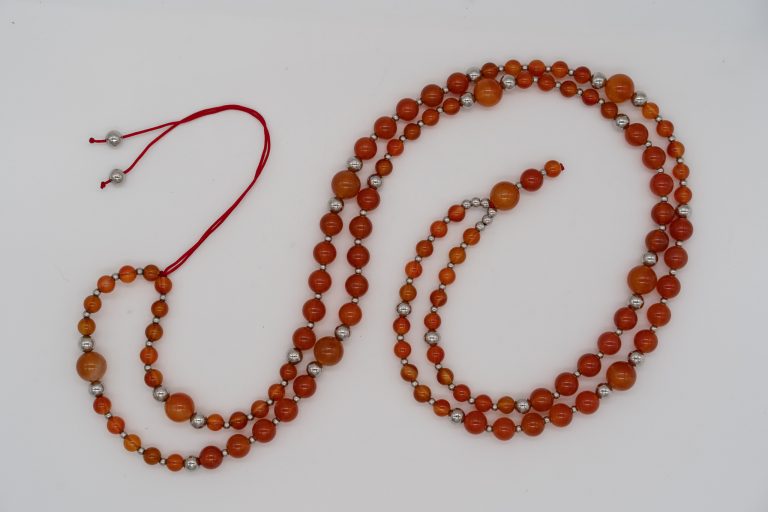 This Carnelian Happy Crystal Mala Necklace is hand-crafted with: