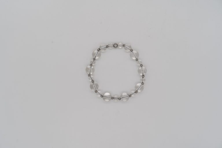 The Clear Quartz Happy Crystal Bracelet is handcrafted with: